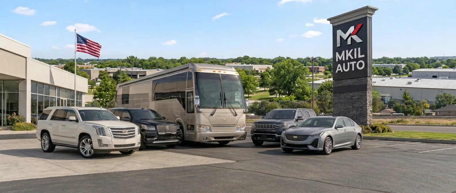 Four American luxury cars — Cadillac Escalade, Lincoln Navigator, Jeep Grand Wagoneer and Cadillac CT5 — with a luxury motorcoach in bright daylight